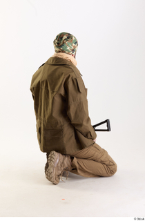 Andrew Elliott Insurgent Kneeling holding gun kneeling whole body 0005.jpg